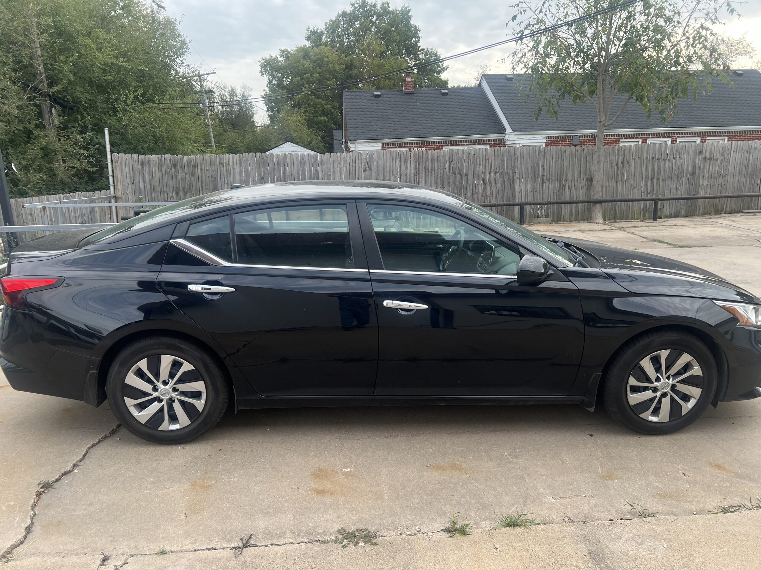 Black Sedan PDR Repair Dents and blemishes completely removed from a black sedan.